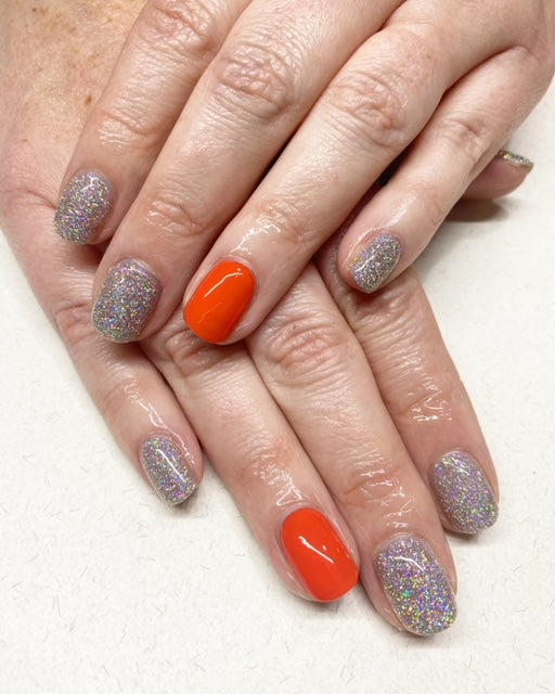 Shimmer nails with orange feature nail