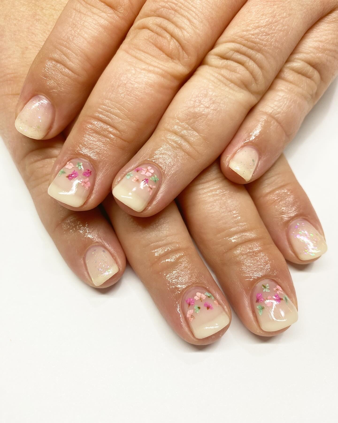 nude nails with rose petal nail art