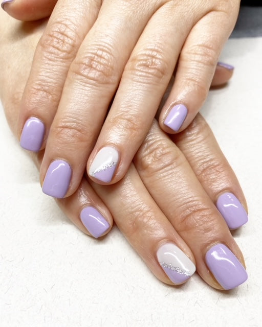 Purple nails with white feature nail