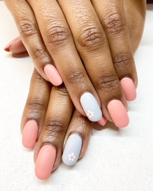 pink nails with light grey feature nail and floral nail art