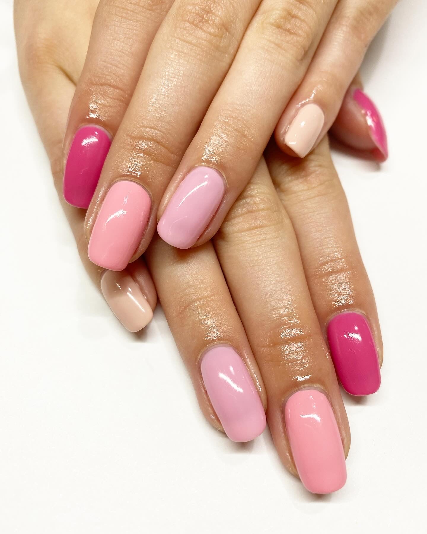 Mix of natural and pink nail polishes