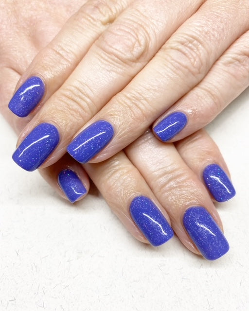 blue shimmer nails on white skin