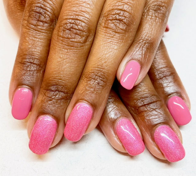 Bright pink nails on dark skin